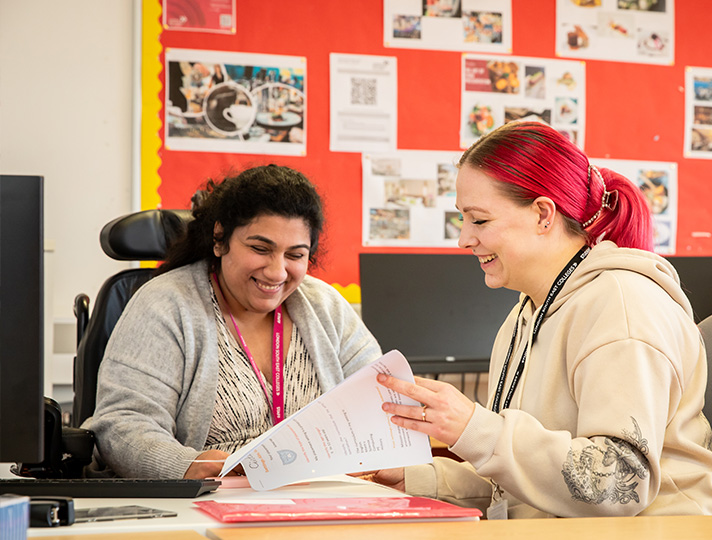 Teacher helping student with work